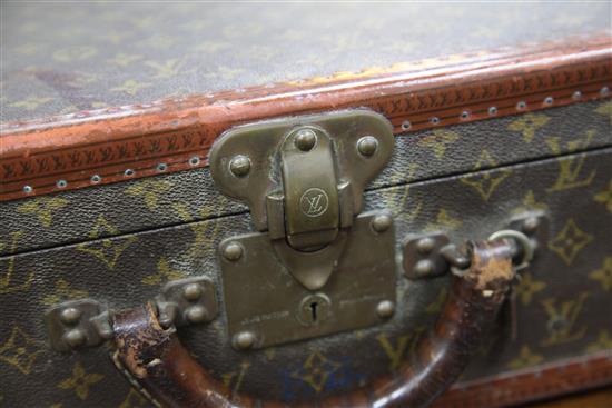 A Louis Vuitton travel case, 19.75 x 14.5 x 7in.